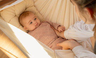 When can babies hold their head up?